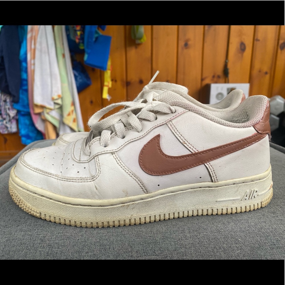 Brown and creme colored air force 1s